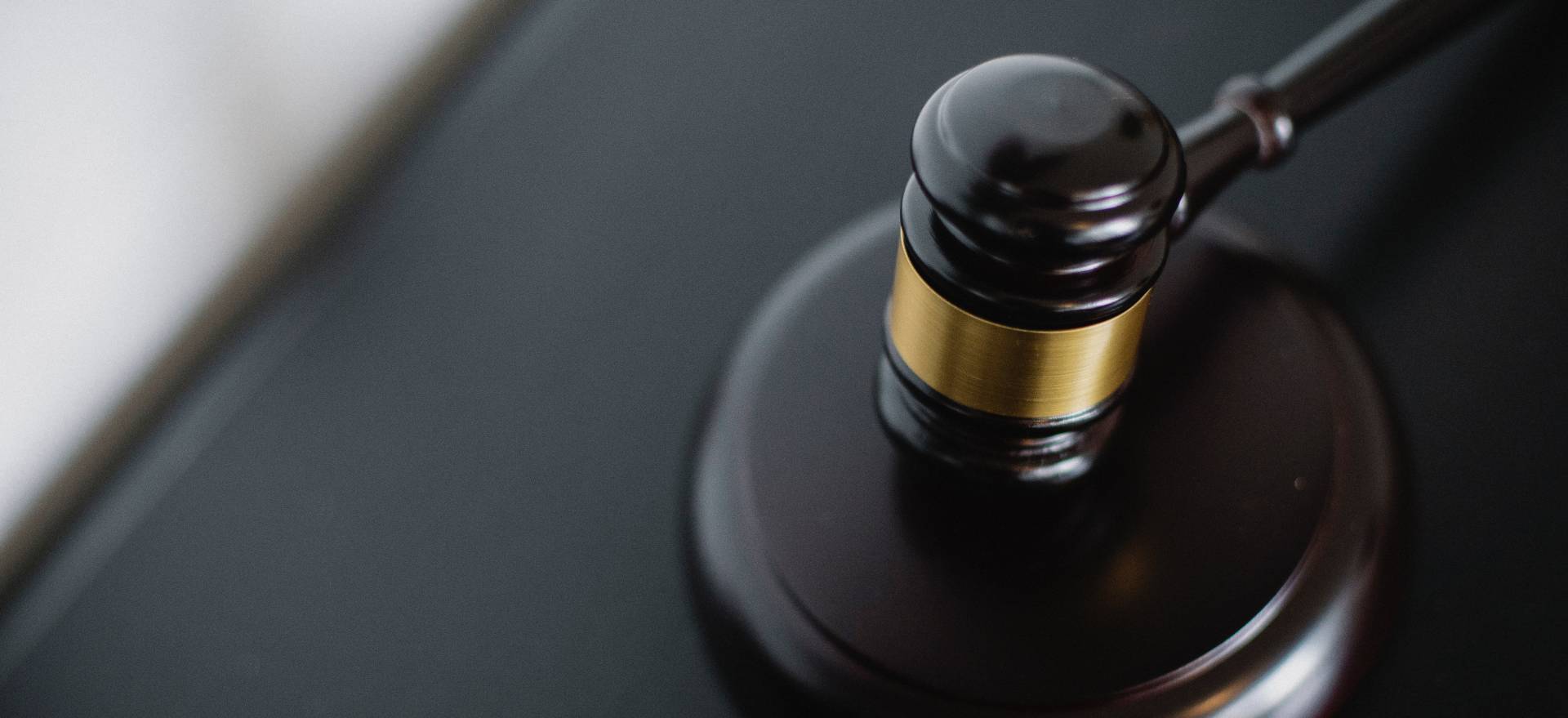 Judge's gavel on a black table